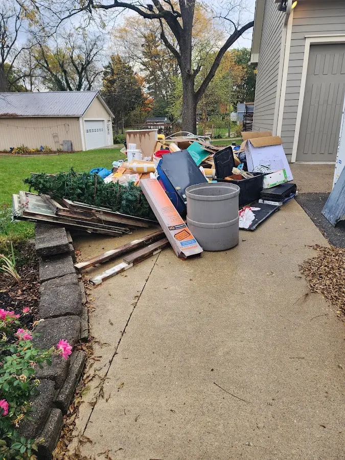 Dumpster being loaded with debris for Commercial Dumpster Rental in Lyman